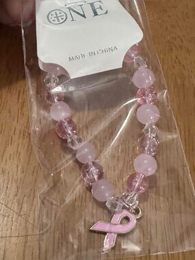 Pink Beaded Breast Cancer Awareness Bracelet
With Pink Ribbon Charm new in pkg